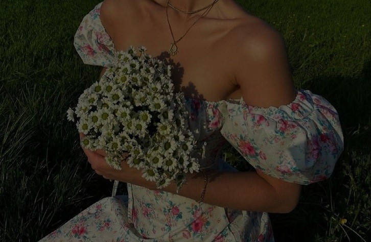 Elegant woman in a Belle & Poise floral dress